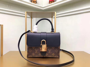 Women Lock Top luxury handbag